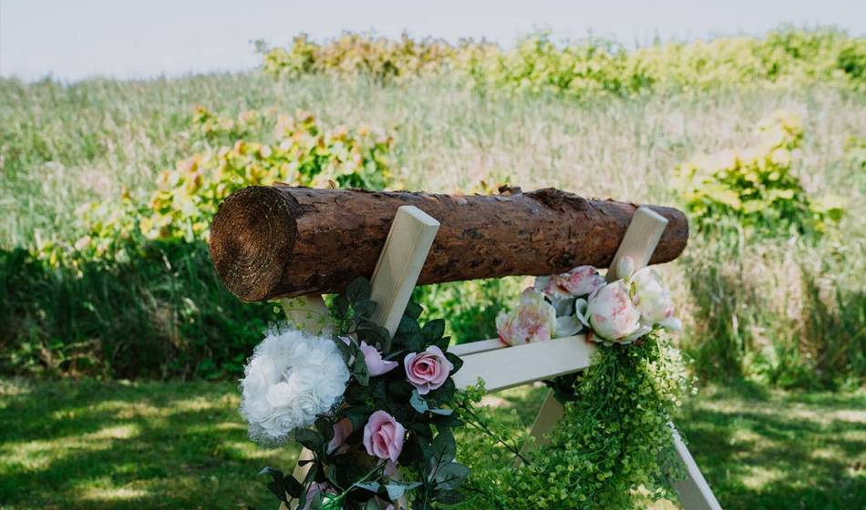 Decorated wedding trunk with flowers and green decoration for traditional ceremonies on the Baltic Sea.