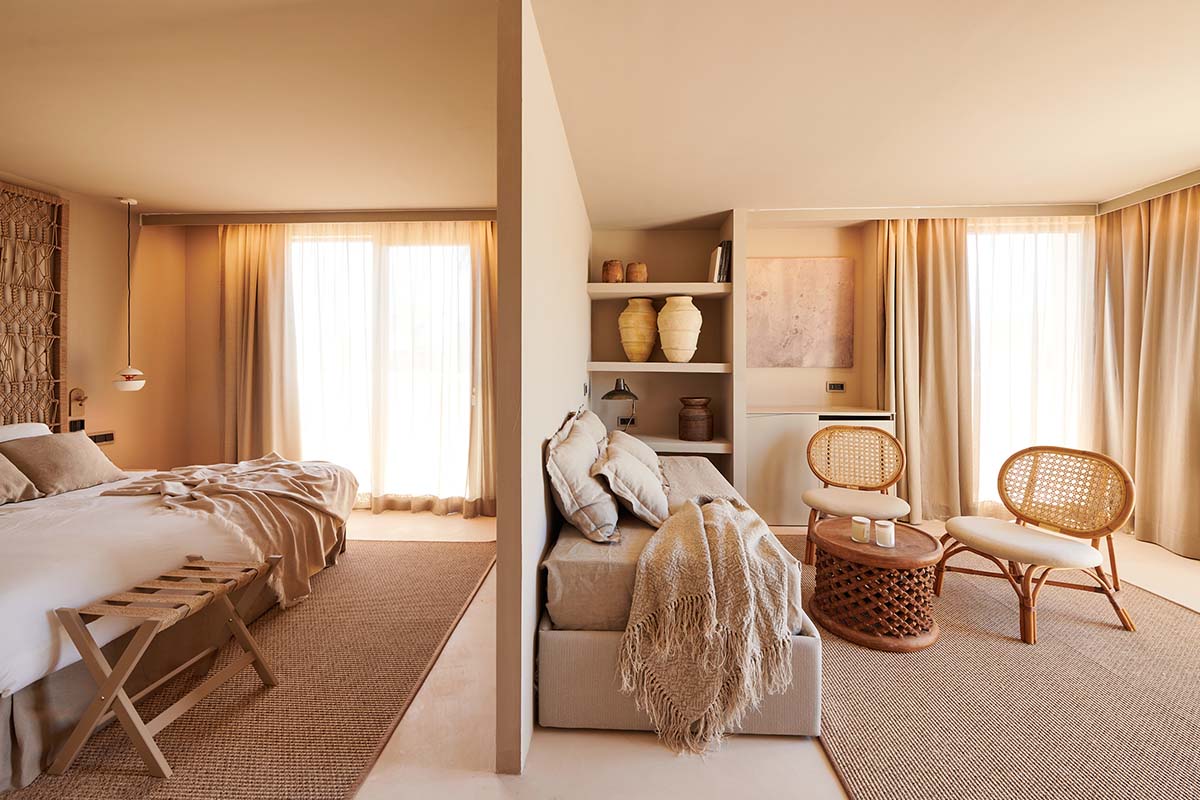 Bright suite with flowing transition between sleeping and living area, furnished in Mediterranean style in the Barefoot Hotel Mallorca.