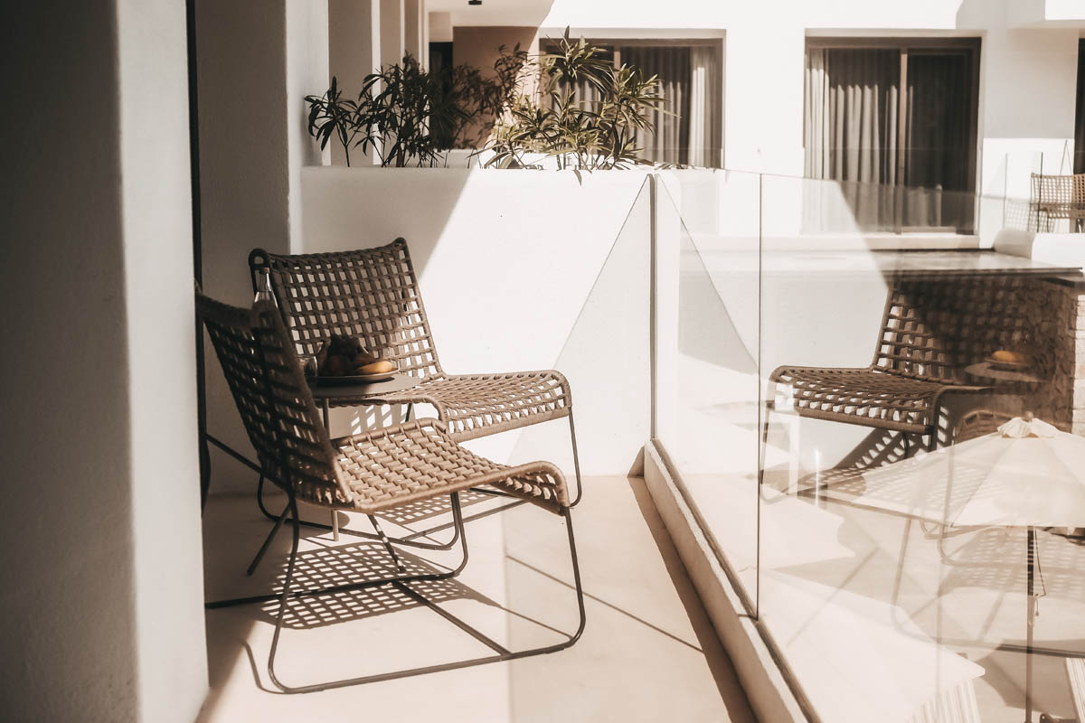 Stylishly furnished balcony in the Deluxe Double Room Oasis at the Barefoot Hotel on Mallorca, perfect for quiet moments.