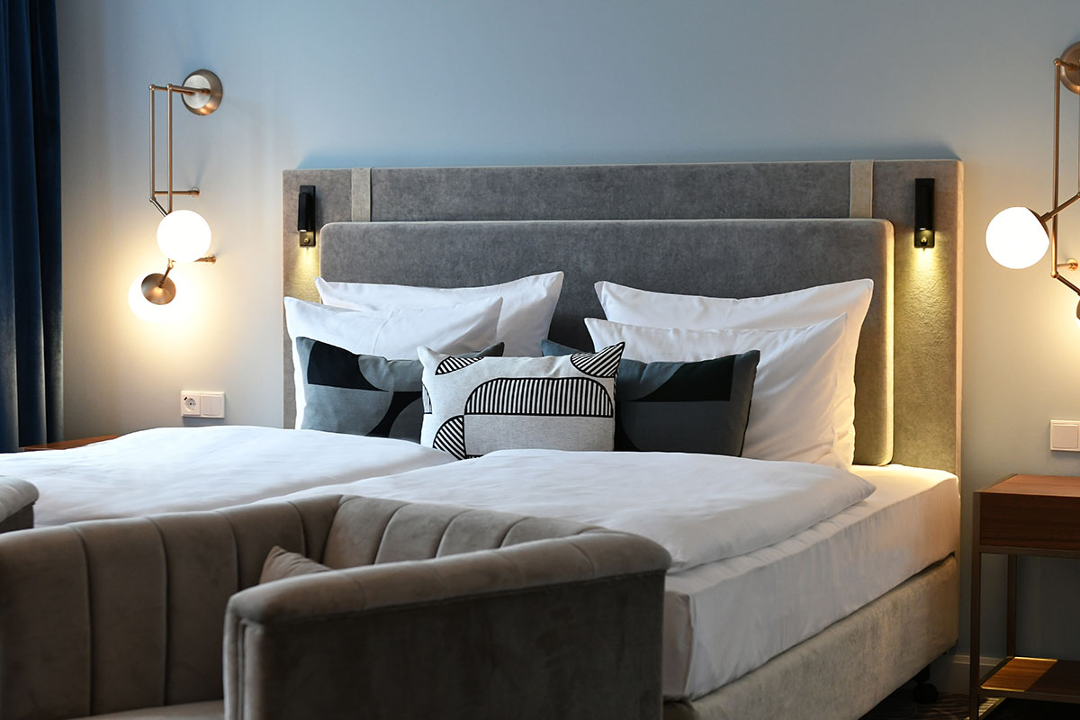Modern and cozy bed in the Grand Deluxe room of the Hotel Elephant Weimar for maximum relaxation.